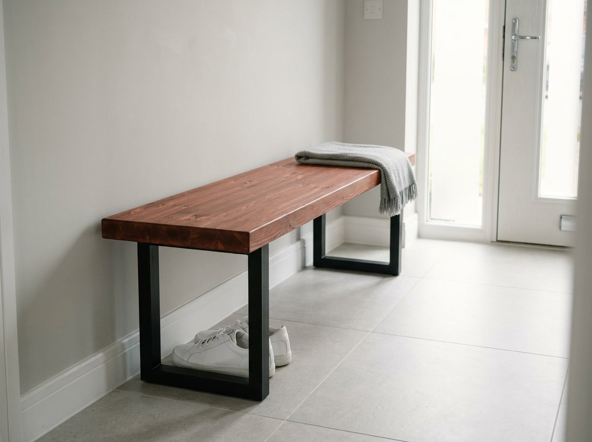A sleek wooden bruton bench with black metal legs natural mahogany finish from the bruton range