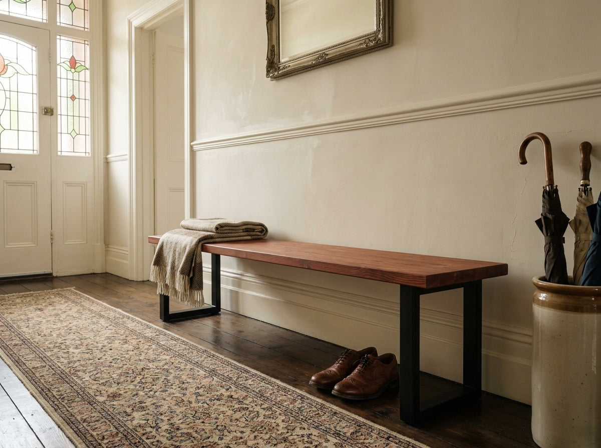 The bruton bench mahogany features a sleek wooden seat with black metal legs and a smooth minimalist design