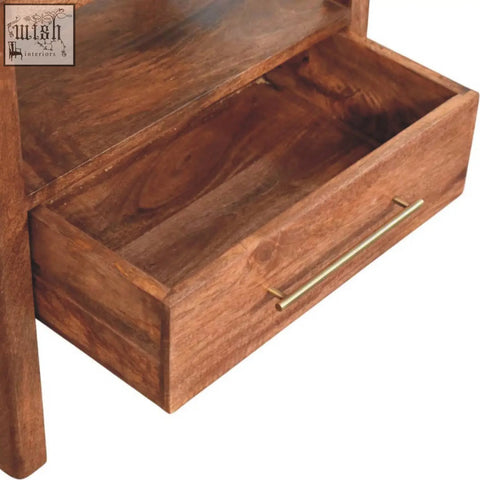 A warm brown wooden drawer with a sleek brass handle on the caldera bedside stand honey caramel open shelf