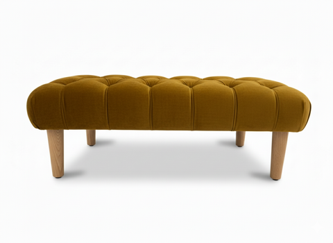 Mustard yellow velvet tufted chester foot stool with light wood legs perfect for cozy seating or resting feet