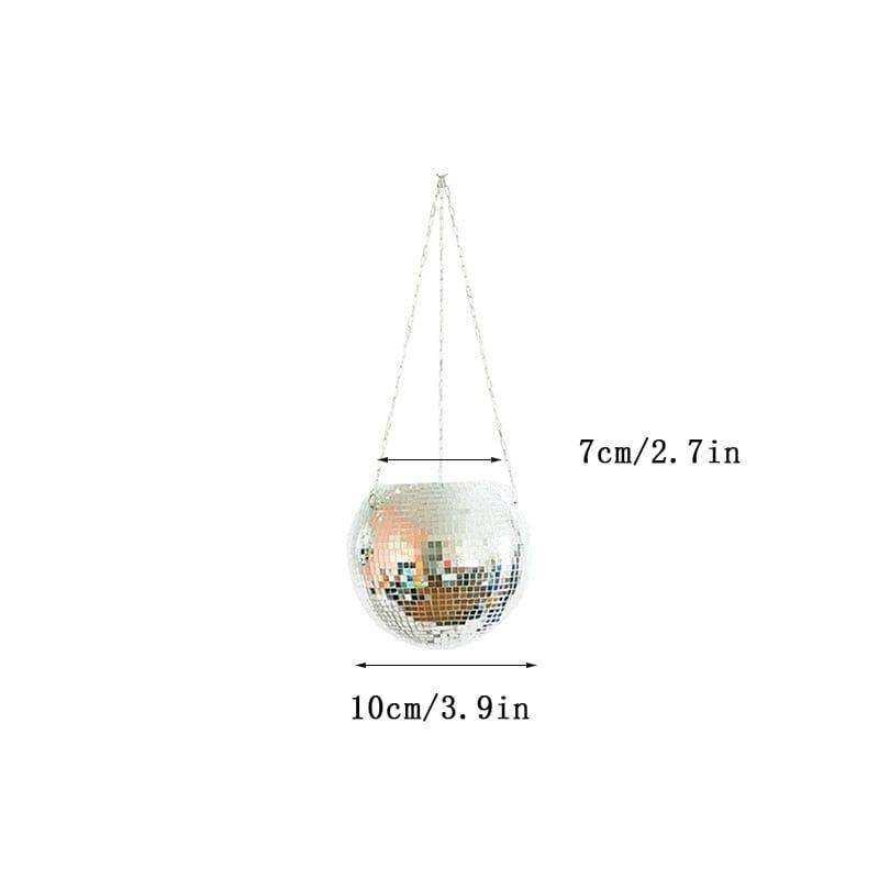 A hanging disco ball planter with reflective mirrored square tiles and silver chains perfect for funky decor