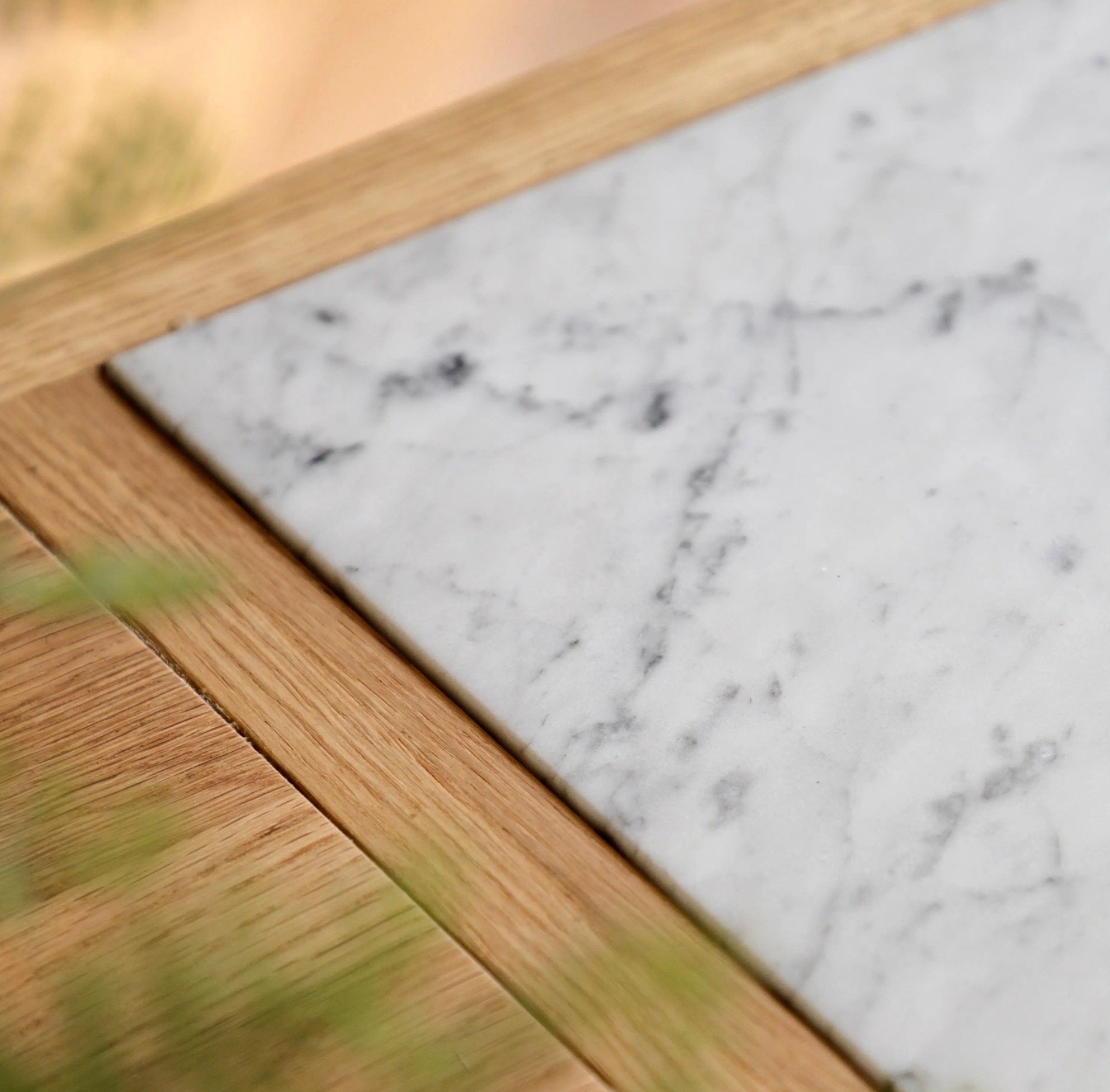 White marble coaster with subtle gray veining and light wood frame for the england kitchen island d650 x h237mm
