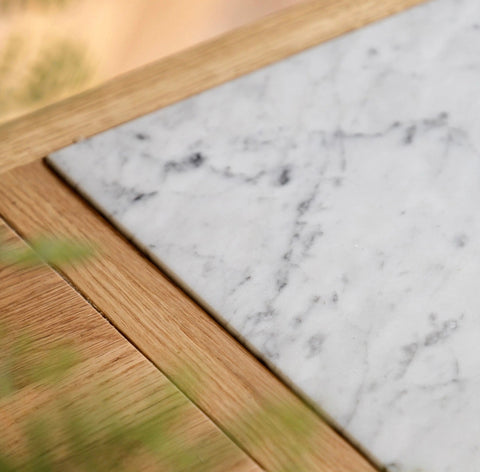 White marble coaster with subtle gray veining and light wood frame for the england kitchen island d650 x h237mm