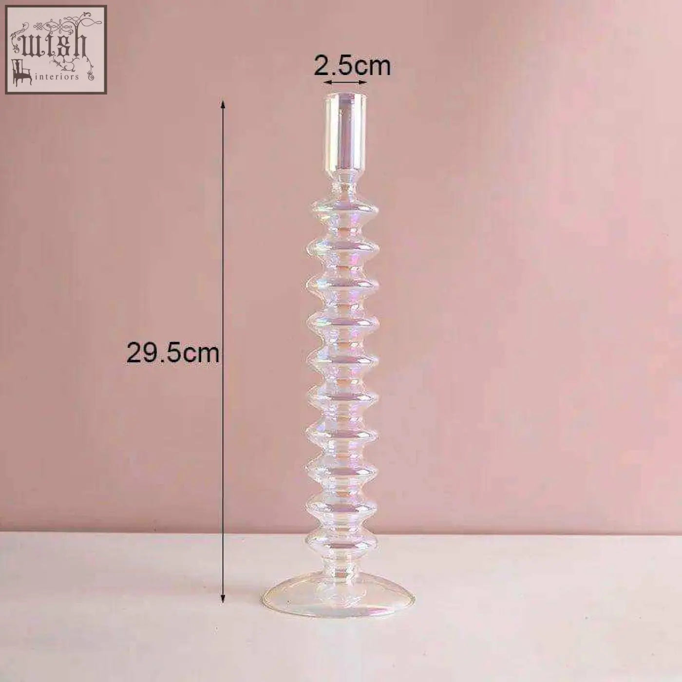 Clear glass candle holder with a spiraled textured body and flared base perfect for holding glass candles