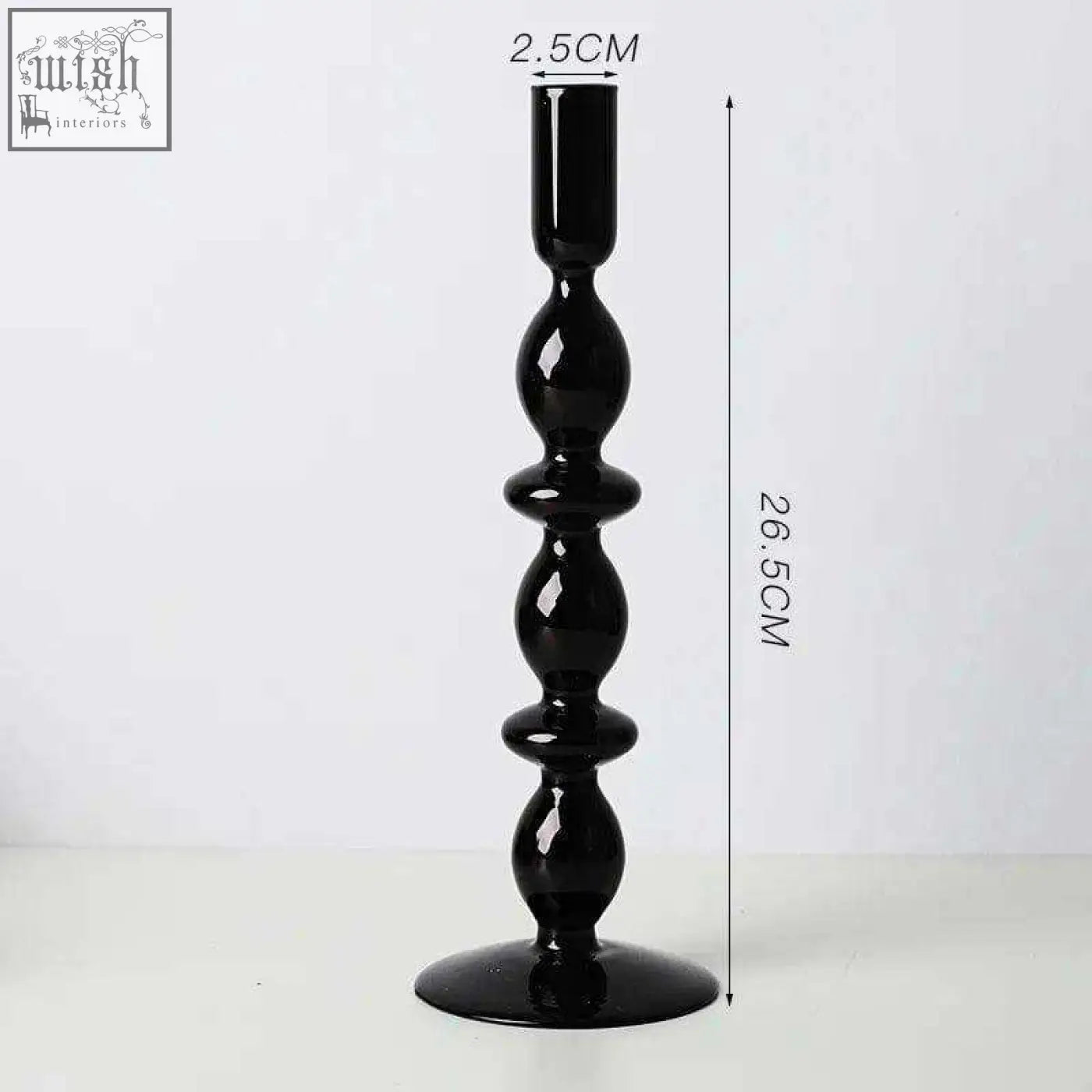 Black glass candle holder with glossy finish and segmented bulbous design perfect as a stylish glass candle holder