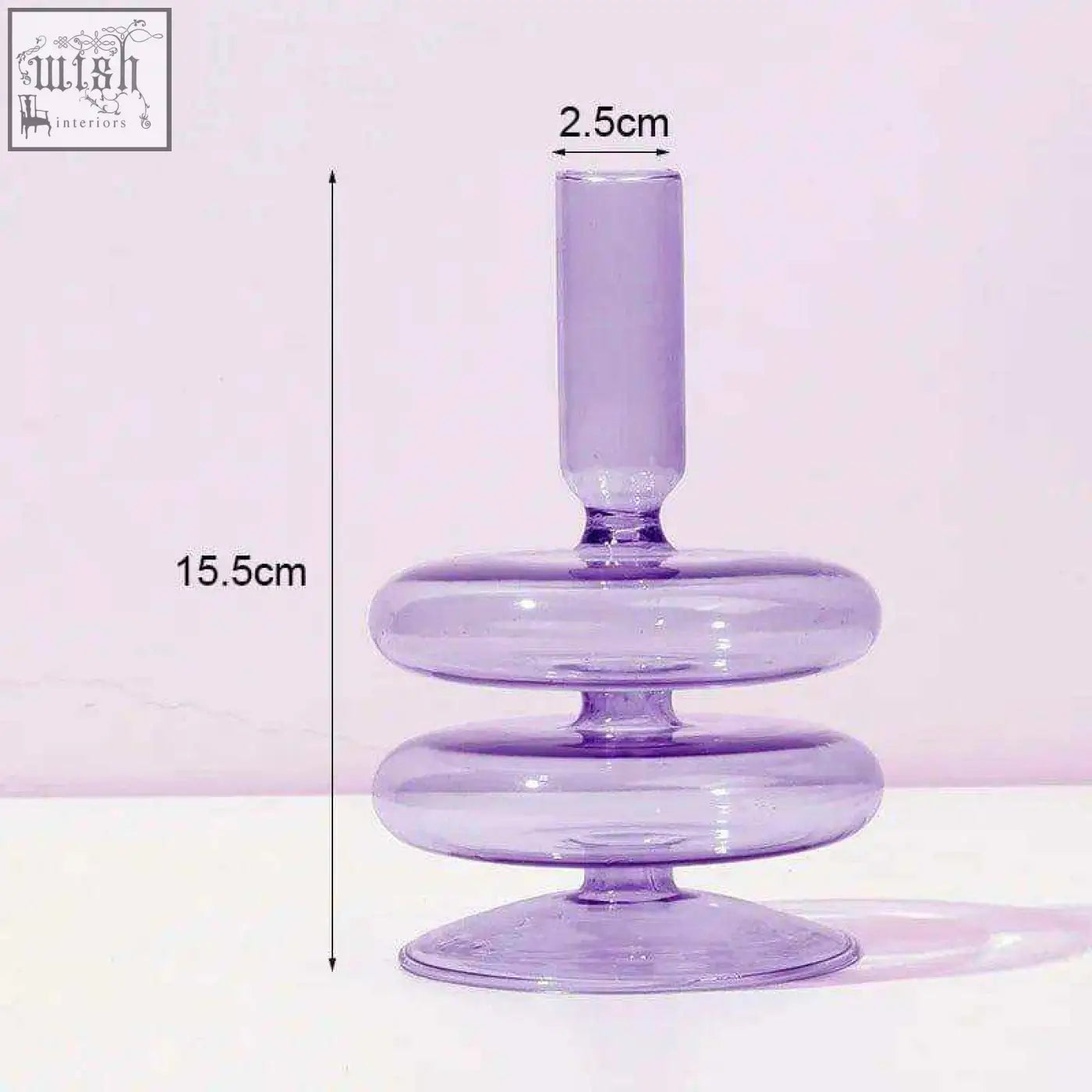 The glass candle holder is a translucent lavender glass candle holder with a tiered ring base and slender top