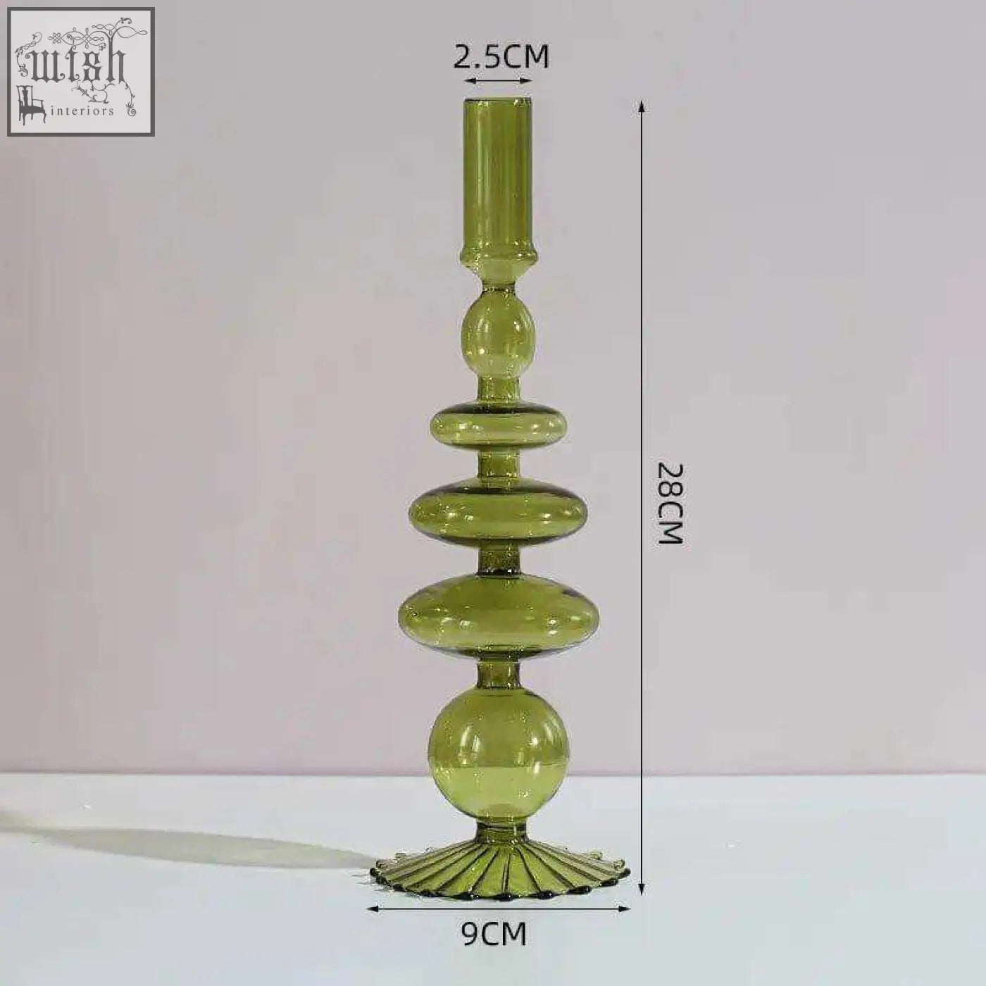 A tall translucent olive green glass candle holder with tiered stacked spherical and oval segments for candles