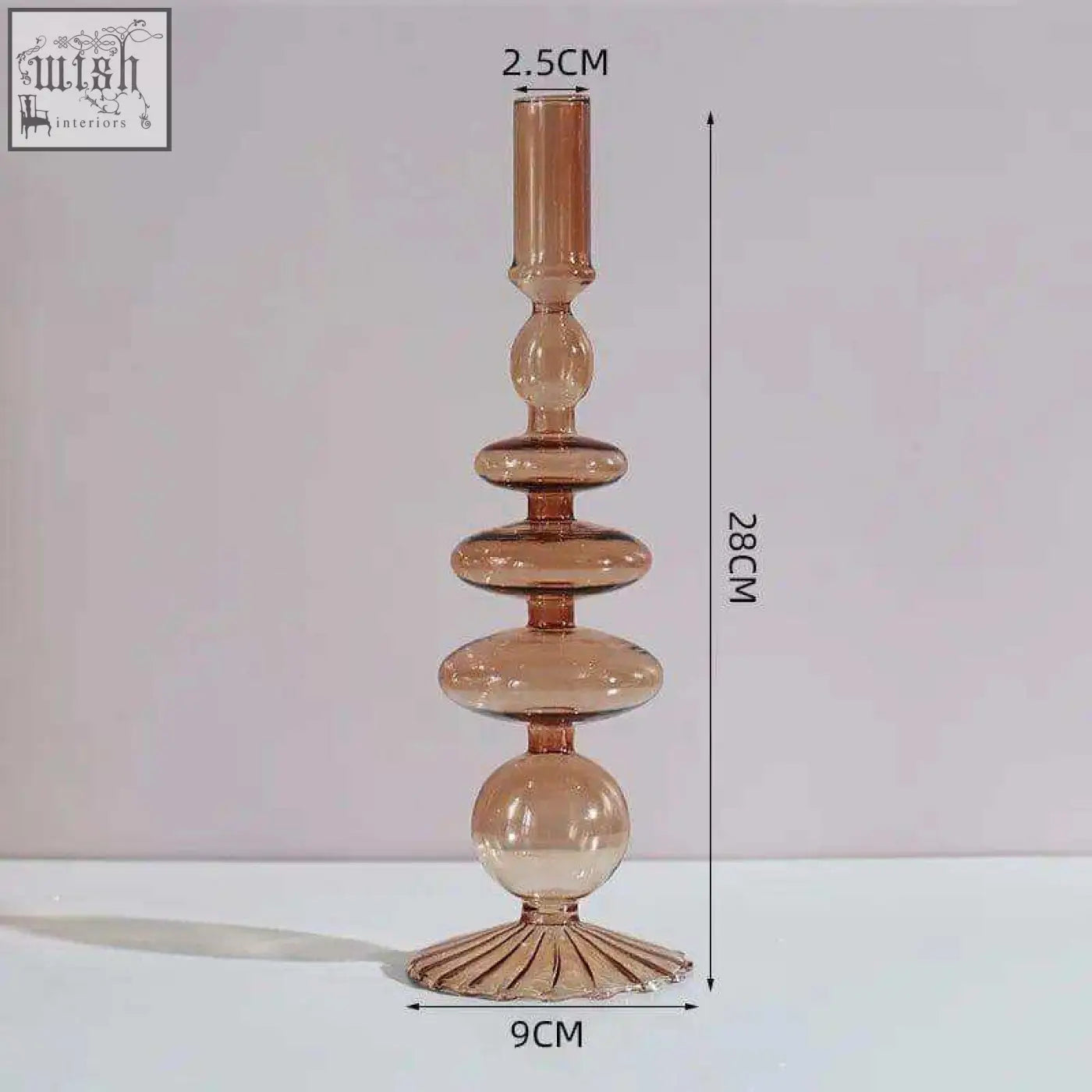 Tall amber glass candle holder with tiered stacked spherical and oval segments perfect as a glass candle holder