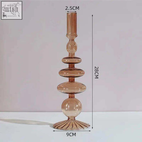 Tall amber glass candle holder with tiered stacked spherical and oval segments perfect as a glass candle holder
