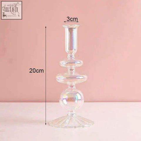 A 20cm tall clear glass candle holder with iridescent finish and tiered fluted base perfect for glass candles