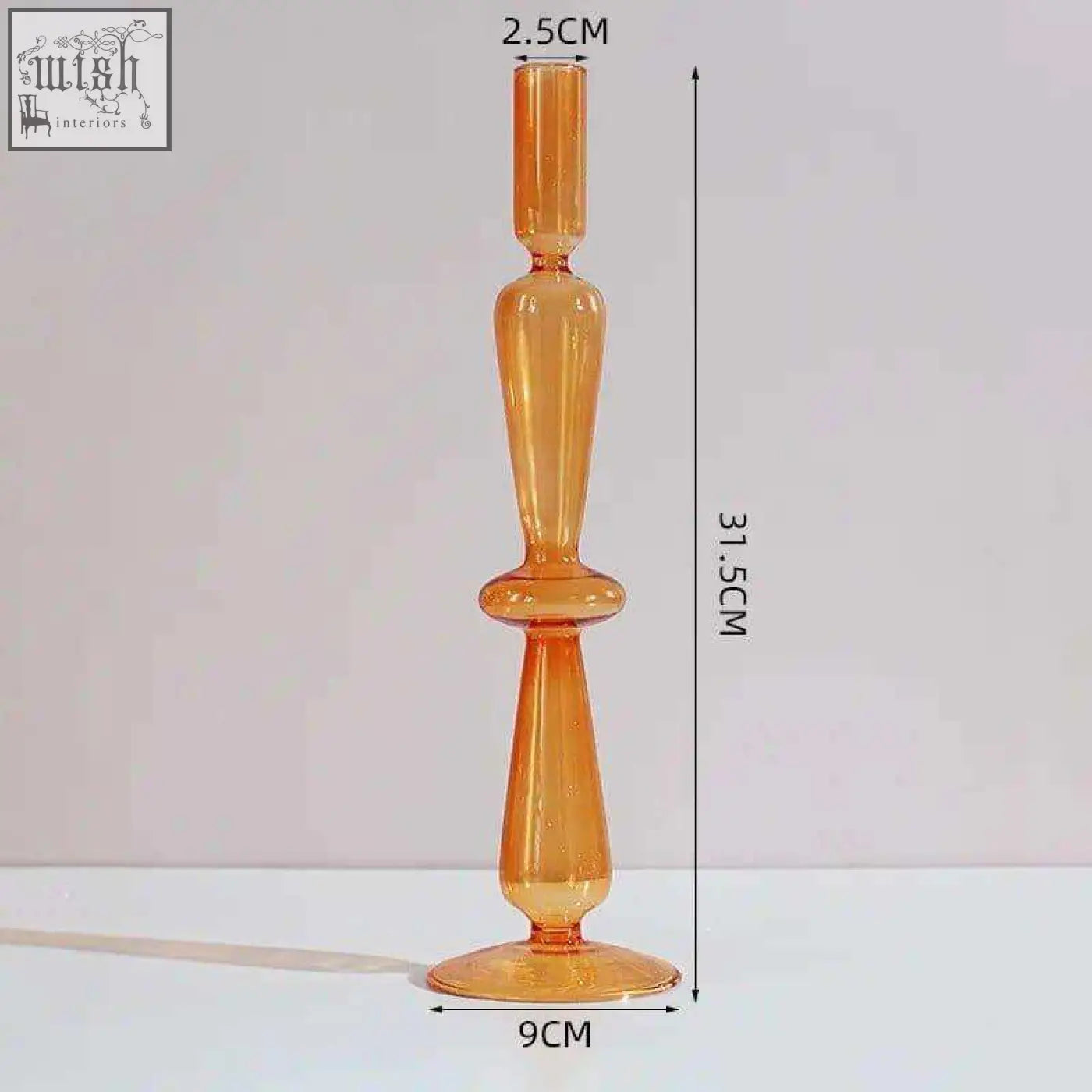 Tall amber glass candle holder with a slender tapered design and flared base perfect as a glass candle holder