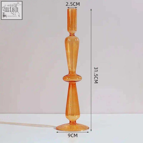 Tall amber glass candle holder with a slender tapered design and flared base perfect as a glass candle holder