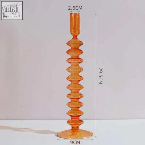 Tall amber glass candle holder with textured segmented design and flared base perfect for glass candles