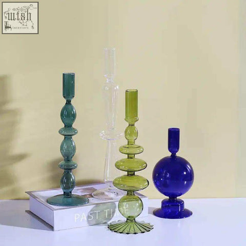 Set of three colorful glass candle holders in teal lime green and cobalt blue with stacked bulbous segments and fluted bases
