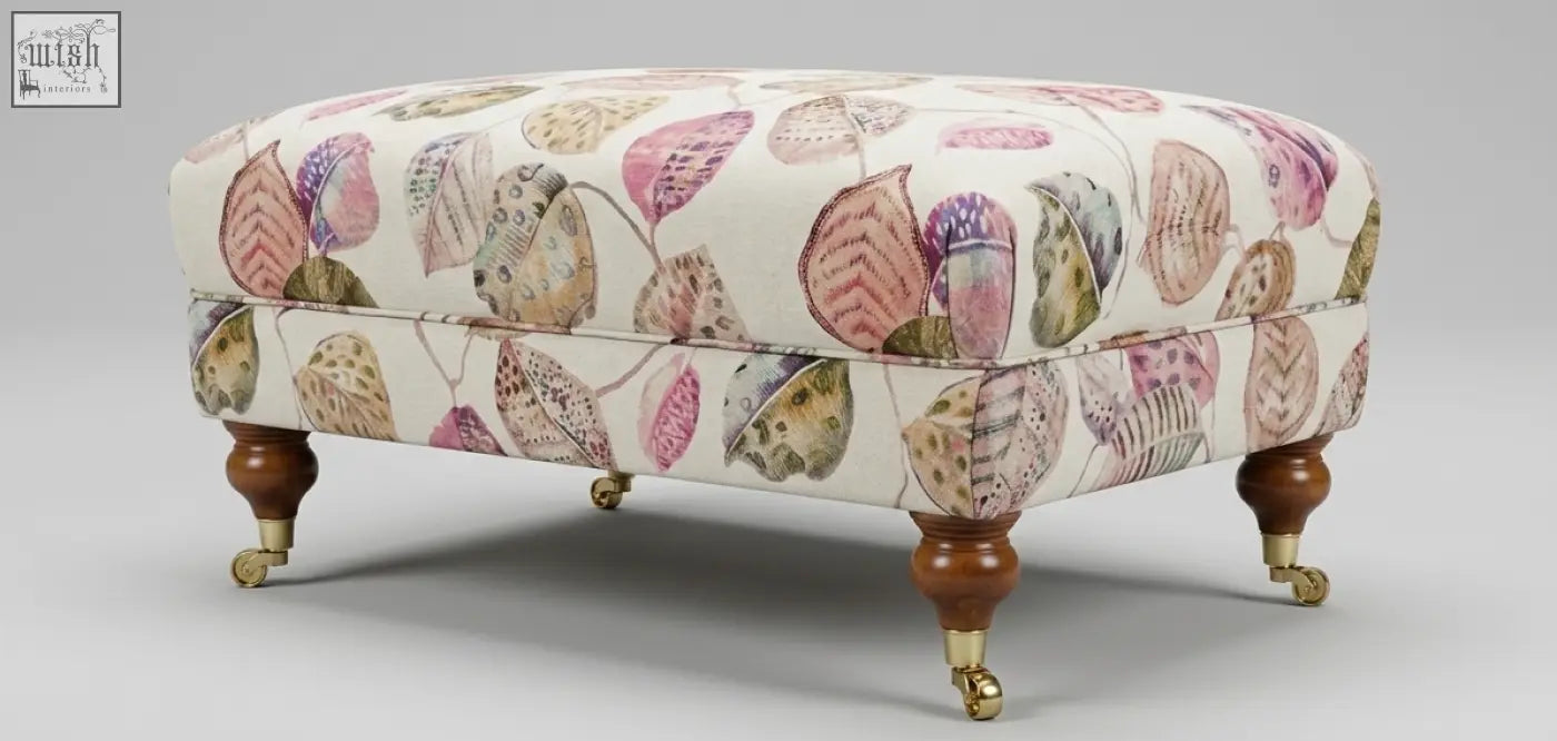 The Highland Foot Stool cream ottoman with watercolor leaf pattern features a solid wood frame leg option and high density foam
