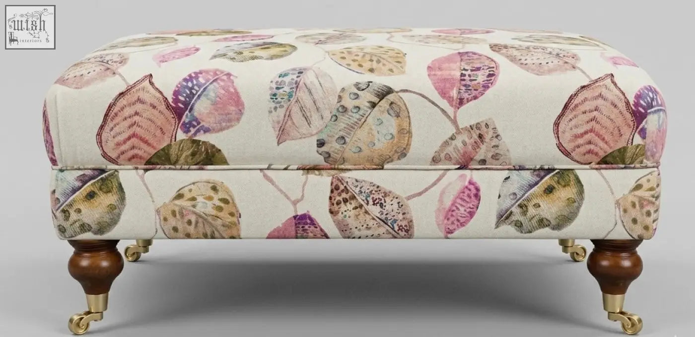 The Highland Foot Stool cushioned ottoman with cream patterned fabric, high density foam, solid wood frame, and leg options