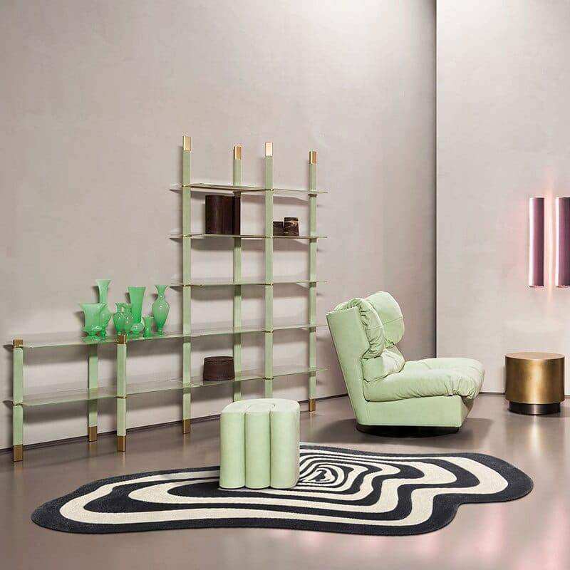 Mint green upholstered armchair with plush cushions and modern design paired with the illusion rug product