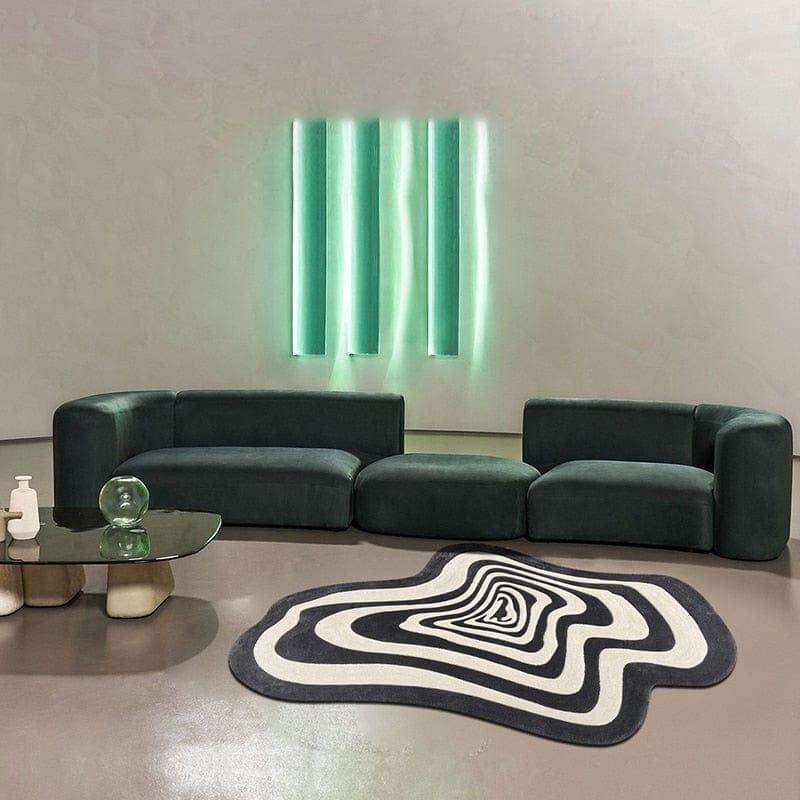 Dark green velvet modular sofa with rounded edges and segmented seating shown with the illusion rug product