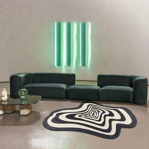 Dark green velvet modular sofa with rounded edges and segmented seating shown with the illusion rug product