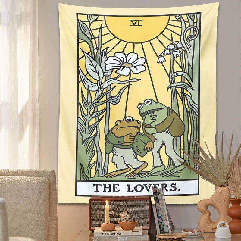 Yellow lovers frog tarot tapestry with two green frogs under a sun and botanical illustrations in black lettering