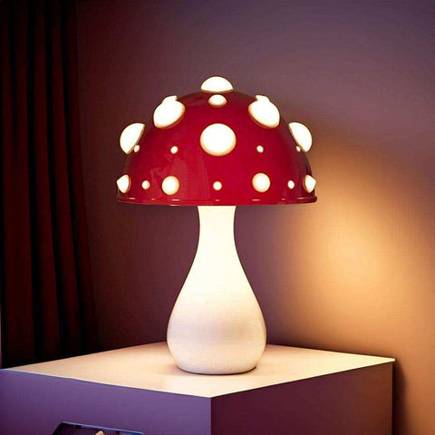 The manita lamp is a glossy red mushroom lamp with white polka dots inspired by the amanita mushroom and plug types