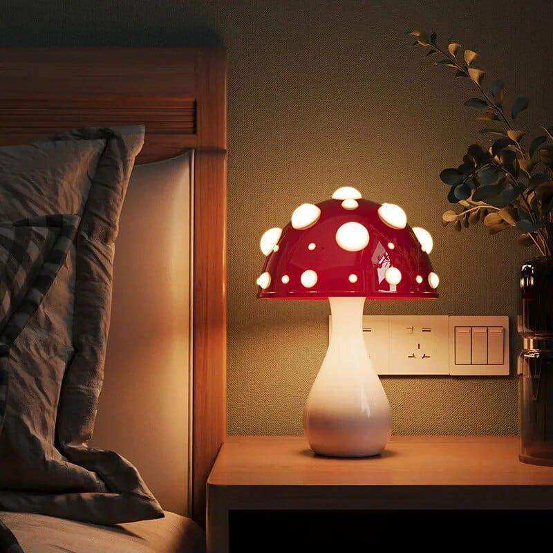 The manita lamp is a red amanita mushroom shaped lamp with white polka dots and a smooth white base ideal for cozy lighting