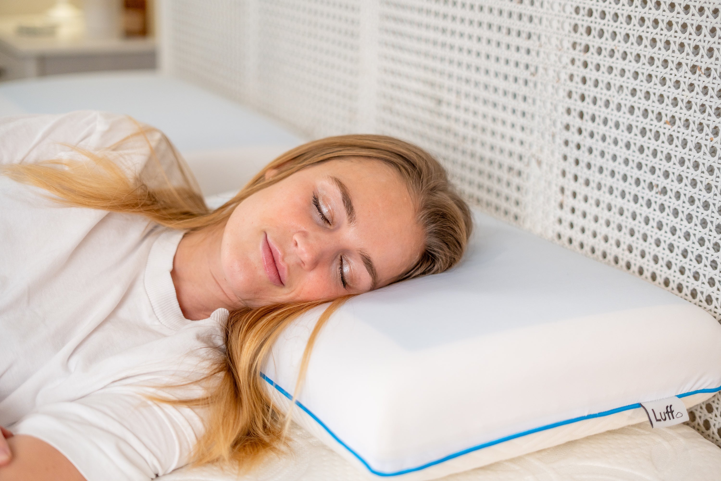 White mayfair cooling gel pillow with blue piping and luff brand label for a cool comfortable sleep