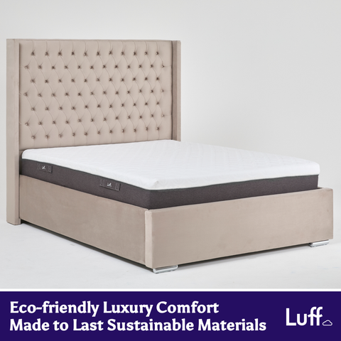 Beige tufted upholstered bed frame with white mattress and dark gray base featuring luff brand logo for the prestige hybrid bamboo mattress