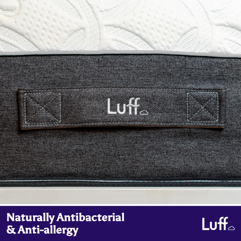 Dark gray fabric label with luff and a cloud icon on the prestige hybrid bamboo mattress cover