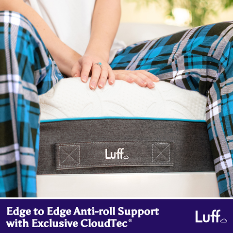 White prestige hybrid bamboo mattress with gray anti-roll band featuring luff logo and blue trim