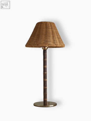 The raffles lamp cordless bamboo lamp with a woven wicker shade and a dark responsibly sourced bamboo stem