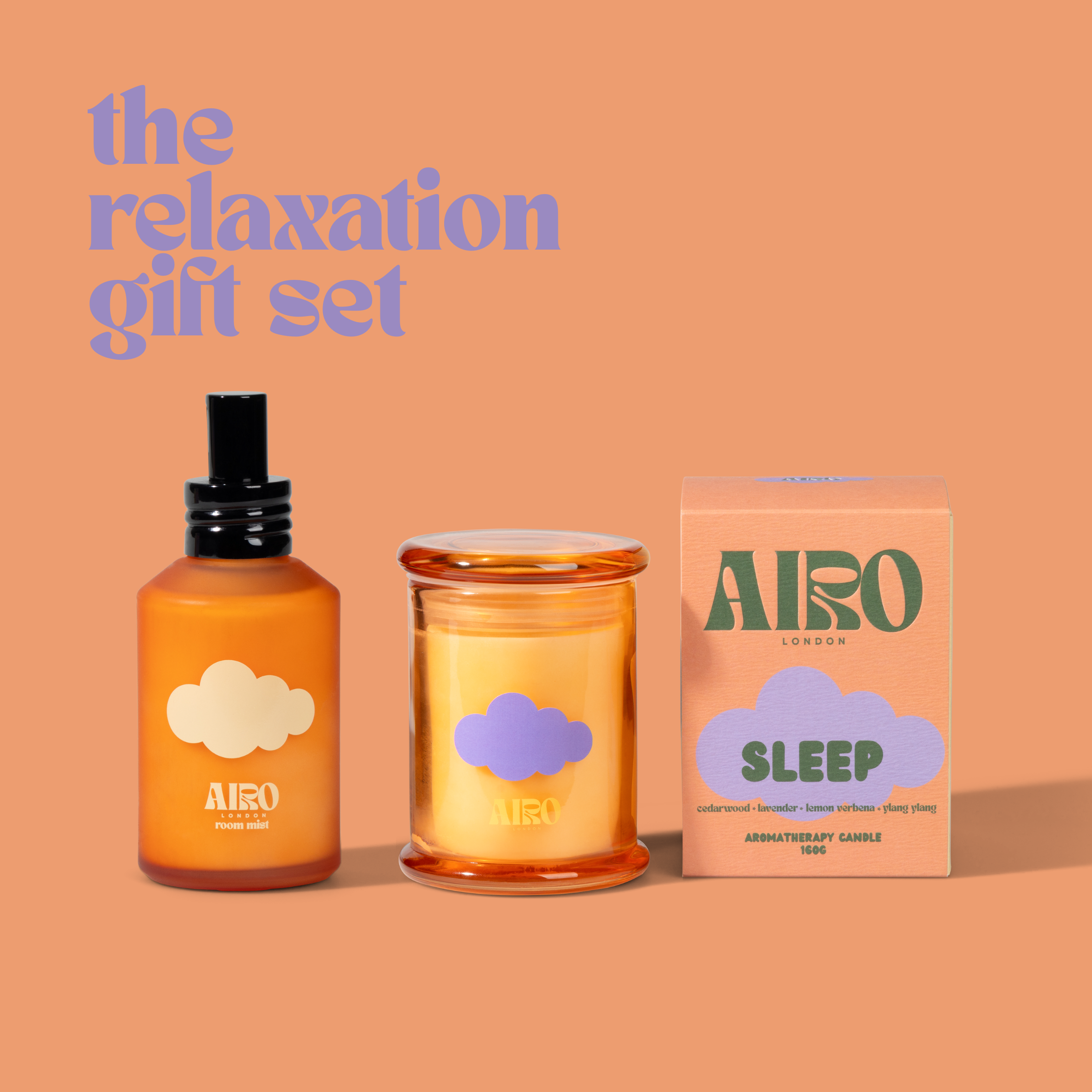 Orange glass bottle with black spray nozzle and white cloud label from airo london in the relaxation gift set sleep mini candle
