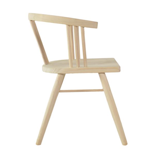 Light-colored wooden chair with minimalist design and slender legs called the scandi 3 spell chair