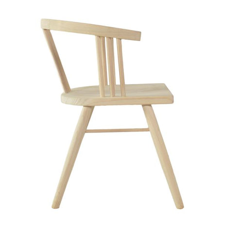 Light-colored wooden chair with minimalist design and slender legs called the scandi 3 spell chair