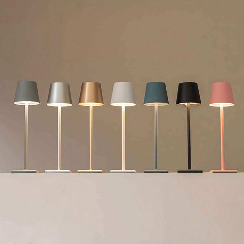 A sleek simplistic wireless led lamp with a minimalist cylindrical shade and slender stem in multiple modern colors