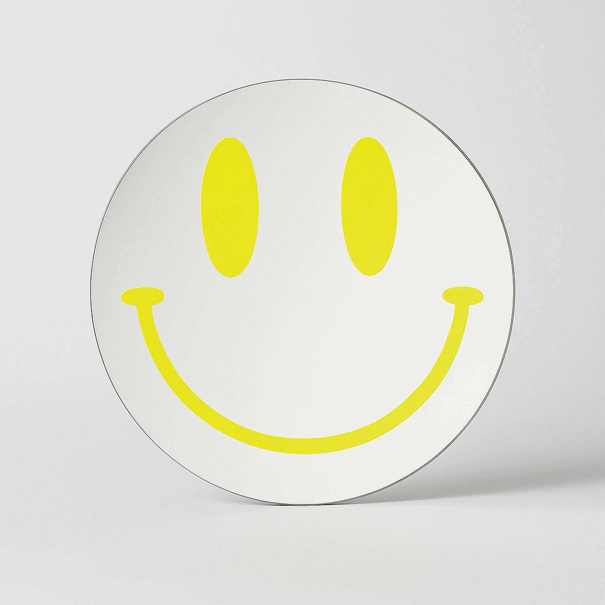 White circular smiley reflections mirror with a bold yellow smiley face design for cheerful wall decor