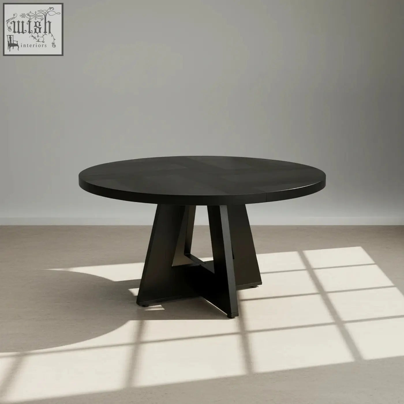 The somerset round oak dining table features a black matte top with geometric pedestal base ideal for dining room use