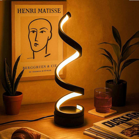 Black spiral table lamp with sleek modern design and warm ambient lighting perfect for cozy spaces