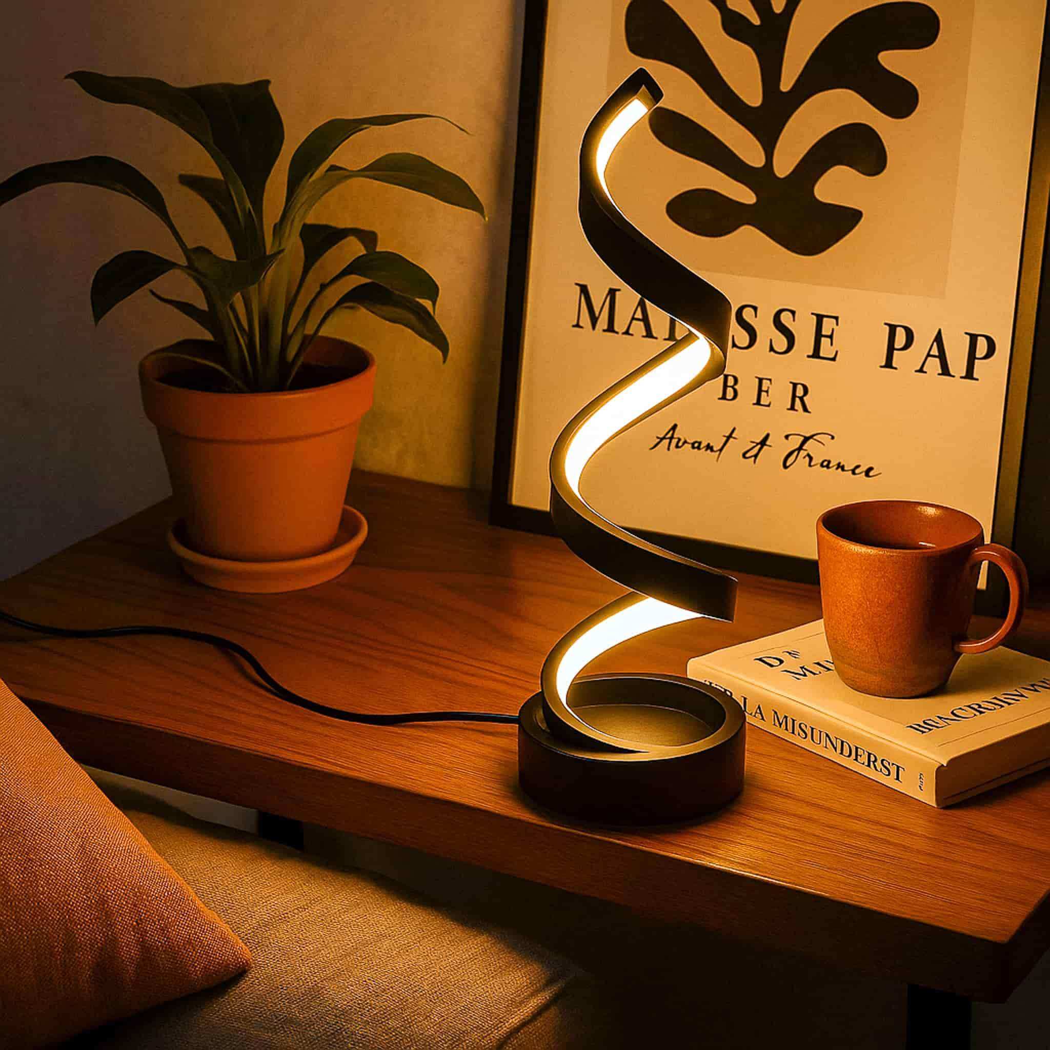 Sleek black spiral table lamp with glowing curved design perfect for modern desk lighting and decor