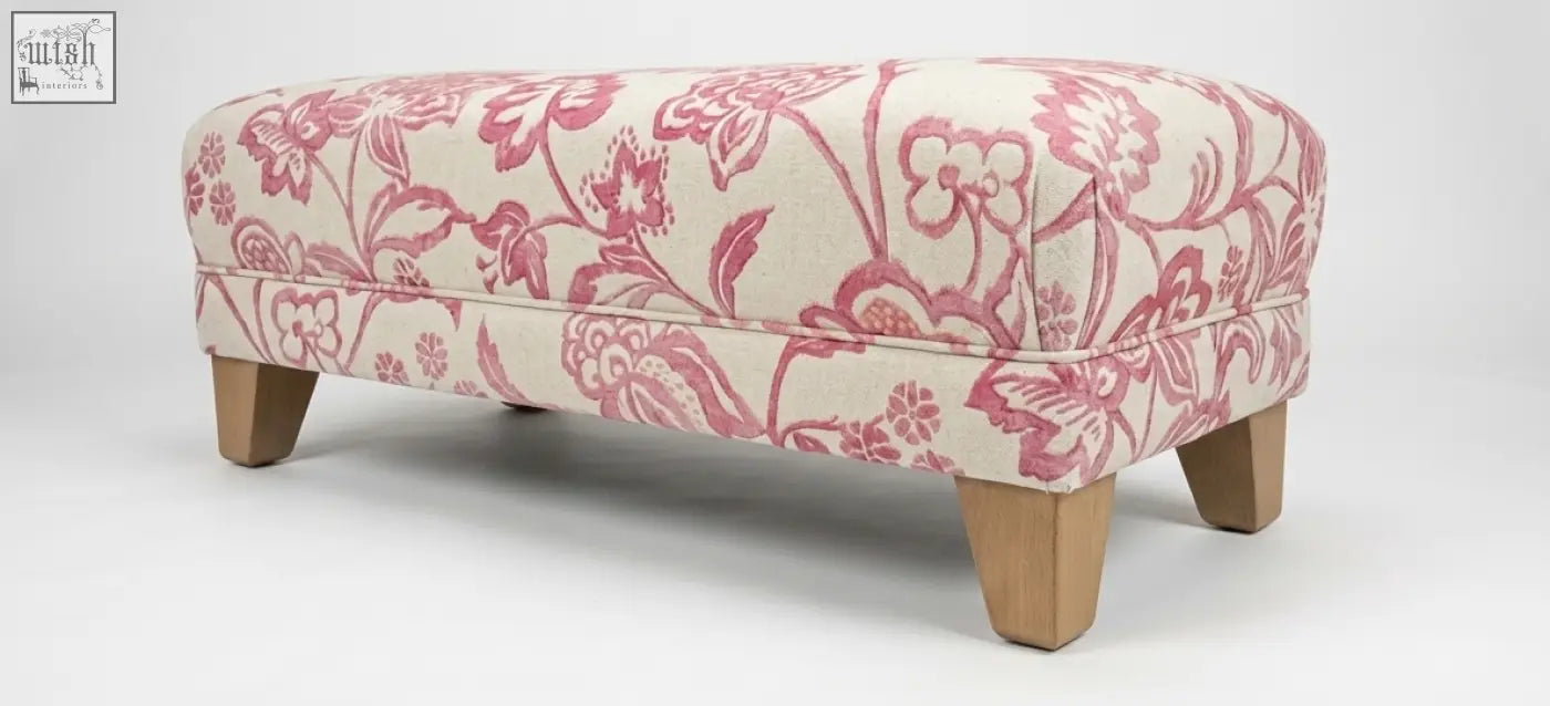 The york foot stool with pink and cream floral upholstery, solid wood frame, high density foam, and leg options