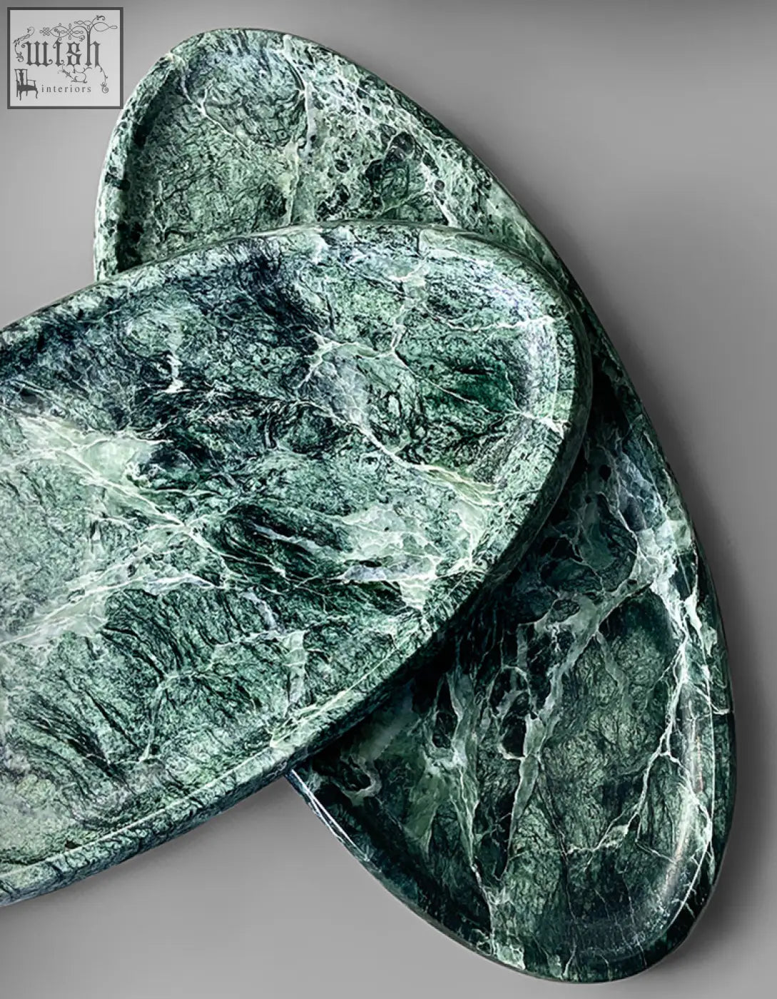 Elegant oval-shaped green marble thelonious plate tray with white veining perfect as a stylish bathroom tray