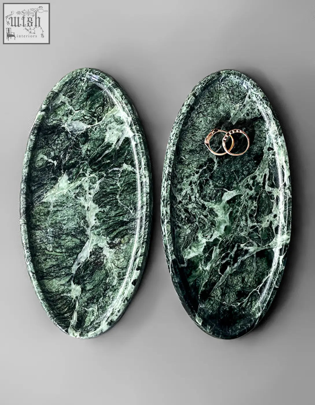 Elegant oval-shaped green marble thelonious plate tray with white veining and rose gold rings stylish bathroom tray