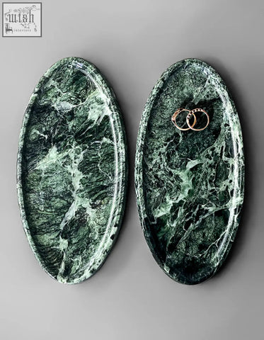 Elegant oval-shaped green marble thelonious plate tray with white veining and rose gold rings stylish bathroom tray