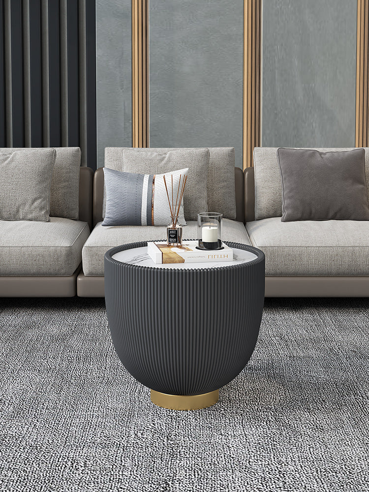 Dark gray ribbed coffee table with white marble top and gold-toned base from the theo coffee table set black