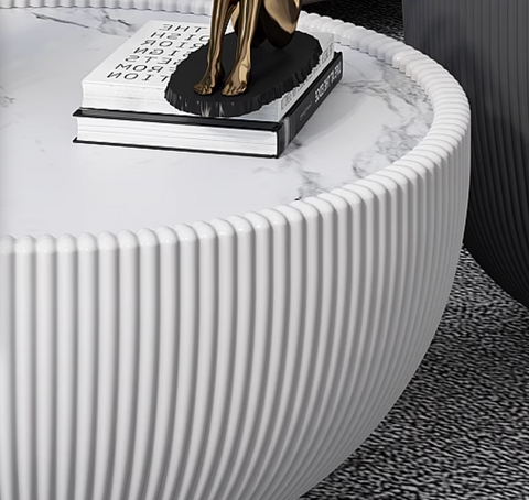White marble-effect round coffee table with vertical ribbed edges in black from the theo coffee table set