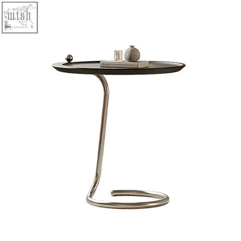 Theo side table black with modern oval top and sleek curved chrome base finished in piano baking varnish