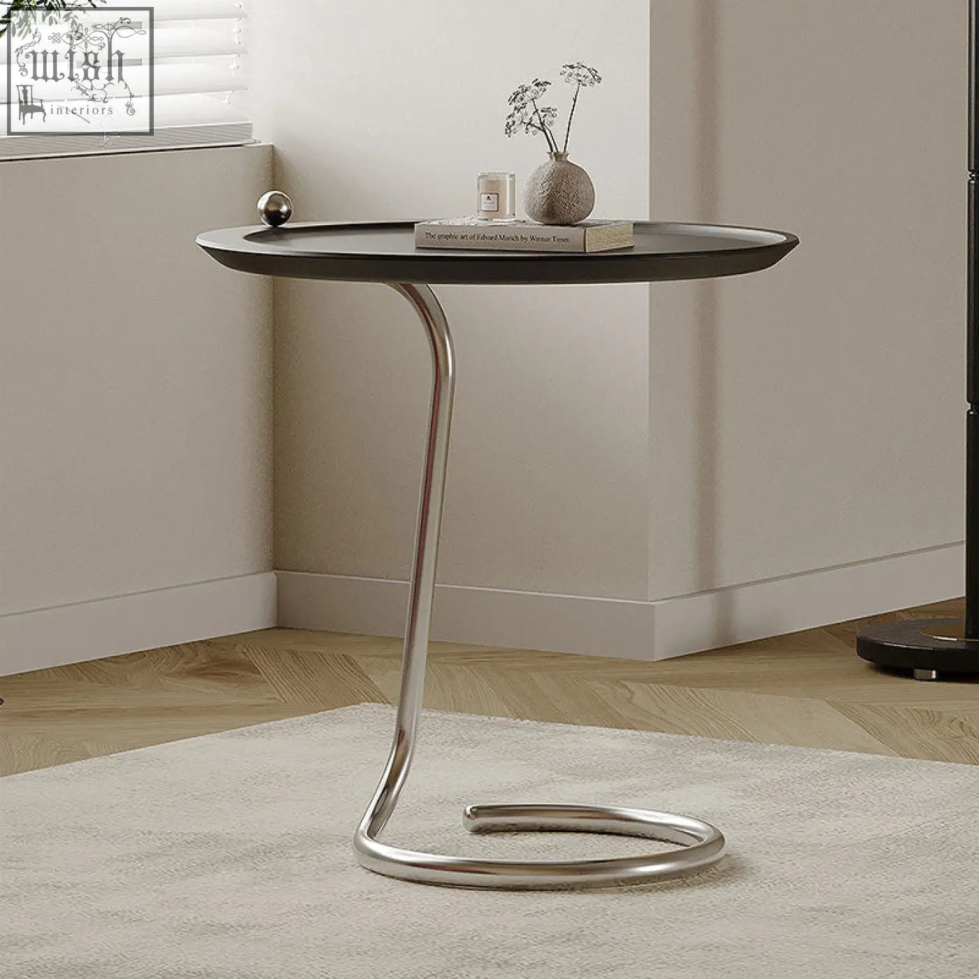 Modern black theo side table with sleek curved chrome metal base finished with piano baking varnish