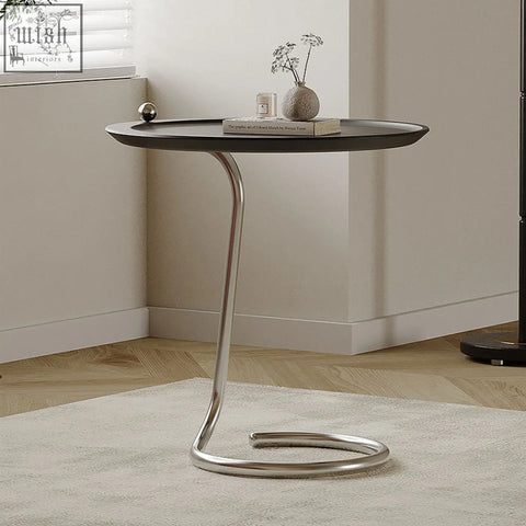 Modern black theo side table with sleek curved chrome metal base finished with piano baking varnish