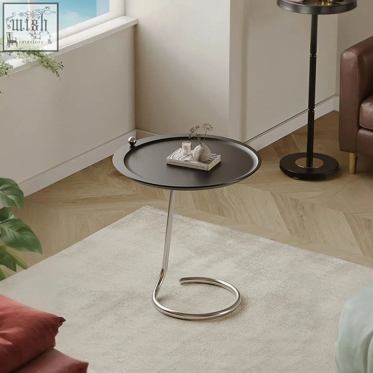 Theo side table black with sleek chrome curved base and small spherical accent finished in piano baking varnish
