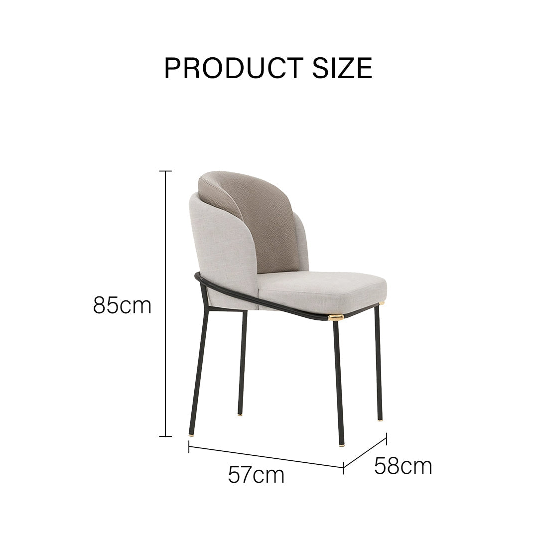 Theobald dining chair with sleek black metal frame and beige fabric seat featuring a textured gray panel